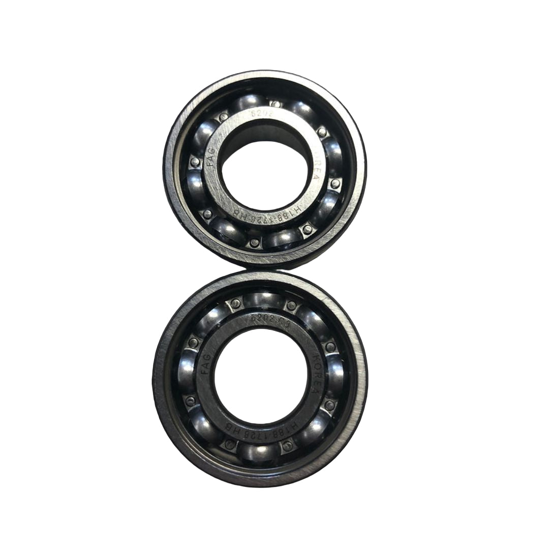 Two metal bearings on a black background
