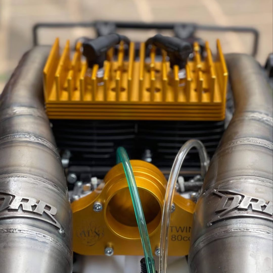 Close-up of a high-performance engine with 'DRP' branding on exhaust pipes.